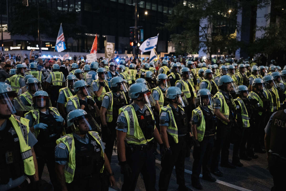 Police stage near Pro-Palestine protesters demonstrating near the Consulate General of Israel during the second day of the Democratic National Convention on August 20, 2024, in Chicago, Illinois.