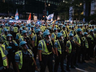 Police stage near Pro-Palestine protesters demonstrating near the Consulate General of Israel during the second day of the Democratic National Convention on August 20, 2024, in Chicago, Illinois.