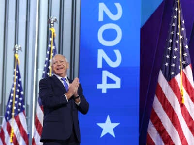 Democratic vice presidential candidate Minnesota Gov. Tim Walz arrives to speak on stage during the third day of the Democratic National Convention at the United Center on August 21, 2024, in Chicago, Illinois.