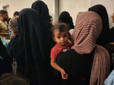 Families wait to have their children receive polio vaccine as part of routine campaign at Al-Amal Hospital in southern Gaza's Khan Younis city on August 22, 2024.