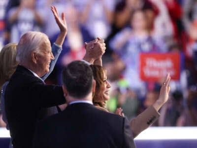 From left: First Lady Jill Biden, President Joe Biden, Vice President Kamala Harris and Second Gentleman Doug Emhoff wave to the audience at the end of the first day of the Democratic National Convention at the United Center on August 19, 2024, in Chicago, Illinois.