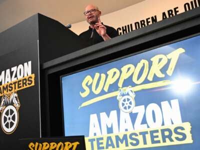 Teamsters General President Sean M. O'Brien speaks during a rally with workers and union members as part of an “Amazon Teamsters Day of Solidarity” in support of the unionization and collective bargaining of Amazon delivery drivers at the Teamsters Local 848 on August 29, 2024, in Long Beach, California.