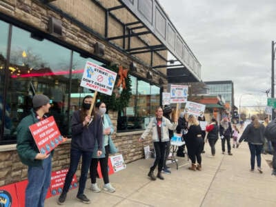 Elmwood Taco and Subs (ETS) workers take part in an unfair labor practice strike in December 2023 in front of ETS in Buffalo, New York.