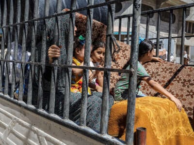 Palestinians, carrying their belongings, follow the Israeli army's warning for the evacuation of Abu Areef and Al-Mazra areas in Deir al-Balah, Gaza, on August 21, 2024.