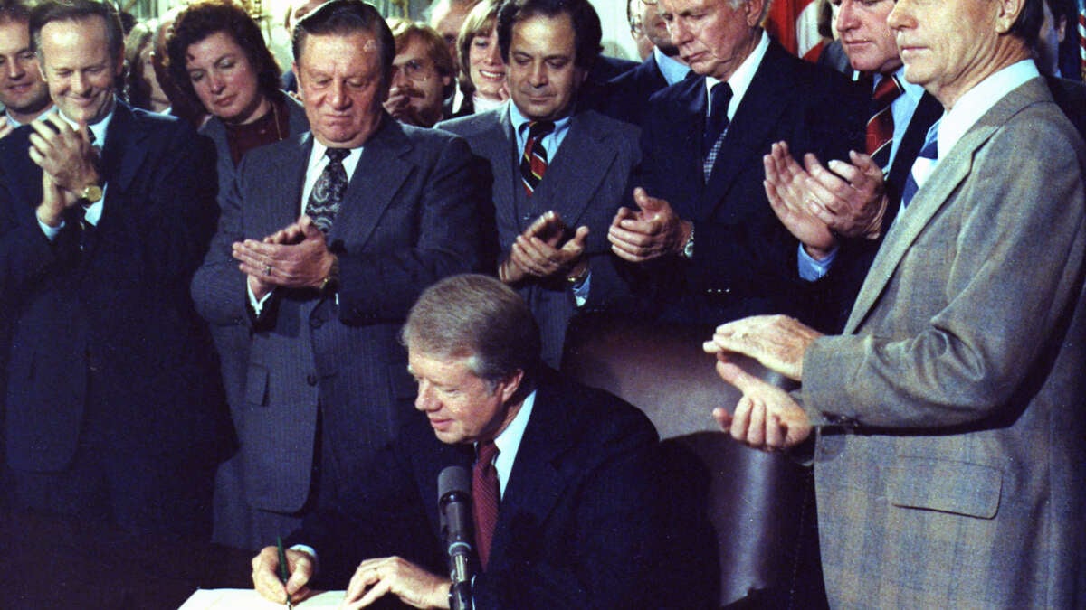 Jimmy Carter signs the Airline Deregulation Act of 1978 on October 24, 1978.