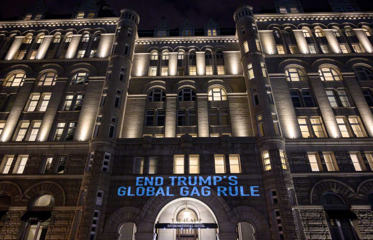 A projection is seen as activists from the Population Connection Action Fund project a message onto the Trump International Hotel, to protest the Global Gag Rule which bans health care providers that receive U.S. global health aid from referring, providing or discussing abortion with their patients, during a demonstration in Washington, D.C. on January 23, 2019.