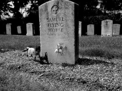 Tombstones of Native children are decorated with small tokens of memory at the old Carlisle Indian School Cemetery, now located on the grounds of the United States Army War College in Carlisle, Pennsylvania, in August, 2010.