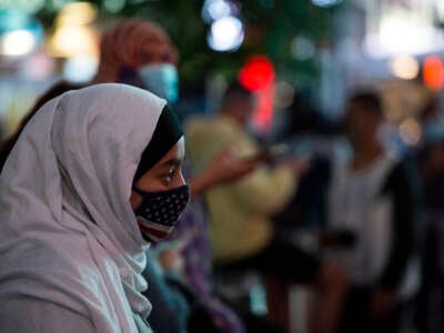 A woman wears a hijab and an American flag mask during an Election Day celebration at Times Square on November 6, 2020, in New York City.