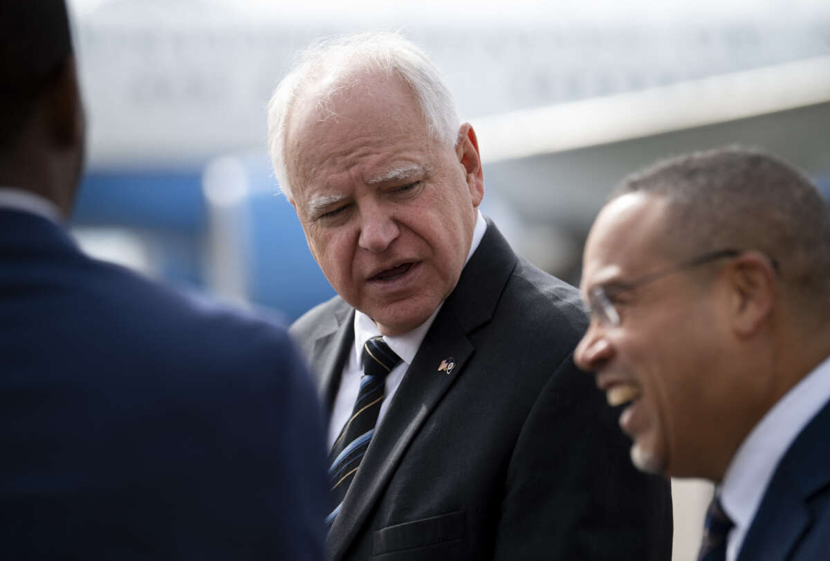 Minnesota Governor Tim Walz awaits the arrival of U.S. Vice President Kamala Harris at the Minneapolis-St. Paul International Airport in Saint Paul, Minnesota, on March 14, 2024.