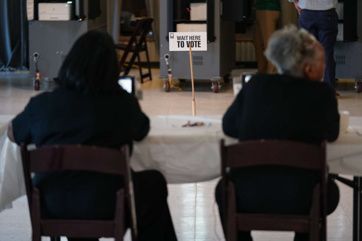 A "Wait Here To Vote" sign is seen in a polling location on May 21, 2024, in Atlanta, Georgia.