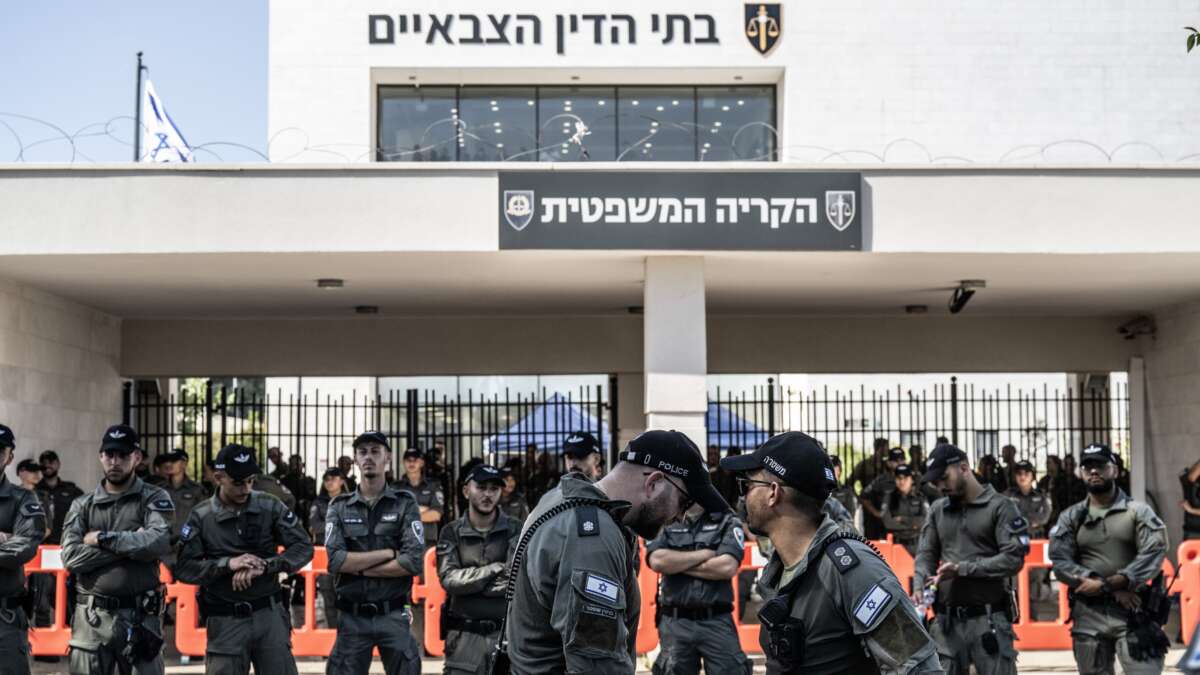Far right Israelis and relatives of soldiers gather in front of the military court building and stage a protest against the arrest of nine soldiers accused of sexually abusing a Palestinian detainee at Sde Teiman Prison in the Negev desert, in Netanya, Israel on July 30, 2024.