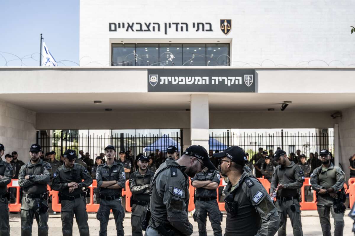 Far right Israelis and relatives of soldiers gather in front of the military court building and stage a protest against the arrest of nine soldiers accused of sexually abusing a Palestinian detainee at Sde Teiman Prison in the Negev desert, in Netanya, Israel on July 30, 2024.