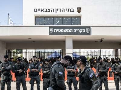 Far right Israelis and relatives of soldiers gather in front of the military court building and stage a protest against the arrest of nine soldiers accused of sexually abusing a Palestinian detainee at Sde Teiman Prison in the Negev desert, in Netanya, Israel on July 30, 2024.