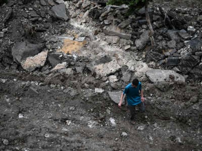 A Palestinian man walks on a street torn up by bulldozers during an Israeli raid in the occupied West Bank city of Jenin, Palestine, on September 1, 2024.