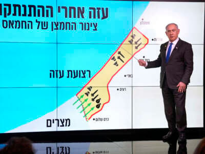 Israeli Prime Minister Benjamin Netanyahu stands before a map of the Gaza Strip during a news conference in Jerusalem on September 2, 2024.