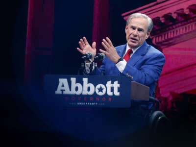 Greg Abbott speaks at a podium