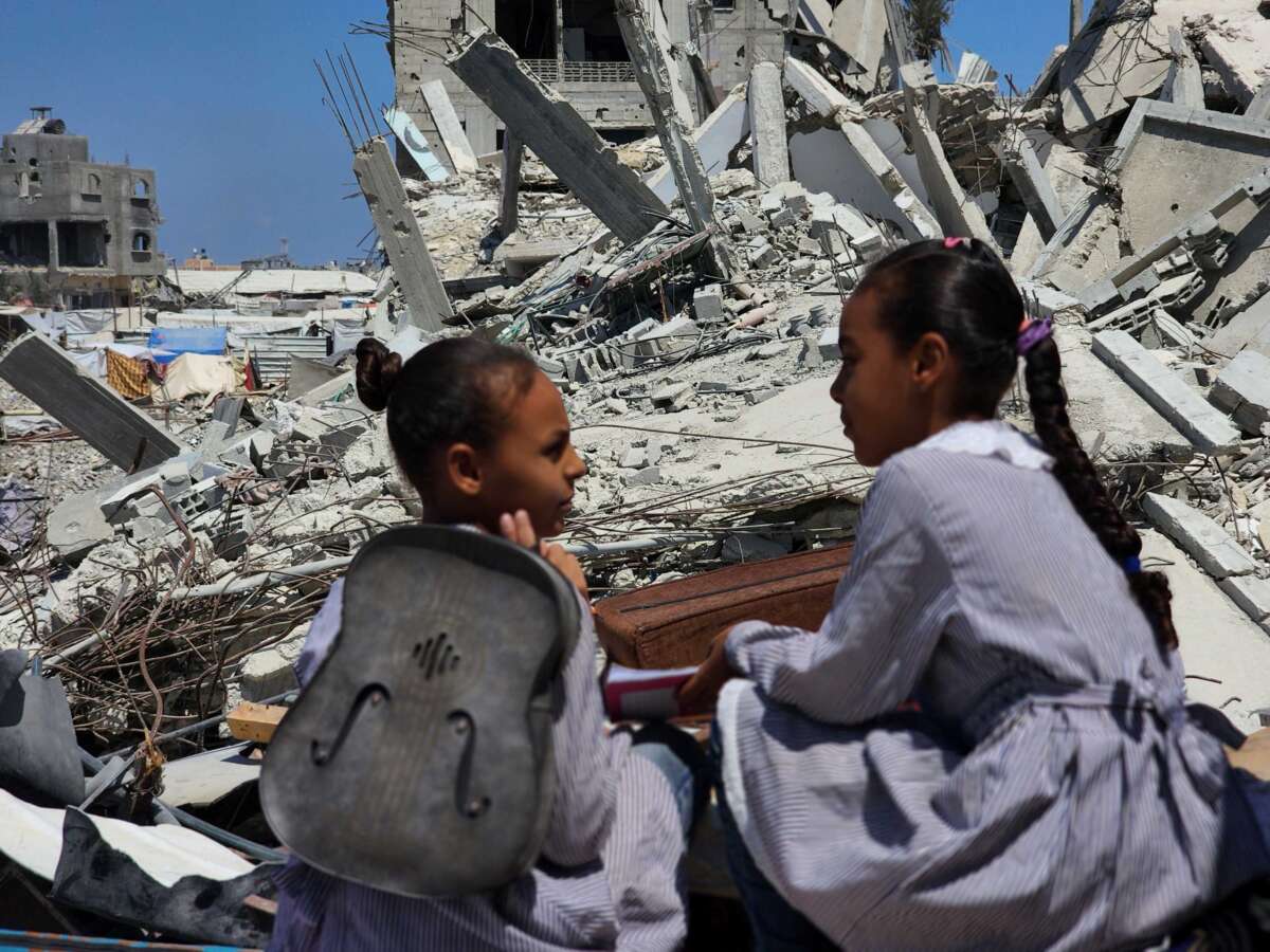 Students speak after lessons at their tent school, in which their teacher Alaa Abu Mustafa, whose house was destroyed in the Israeli army's attacks, gives them education in Khan Younis, Gaza, on September 3, 2024.