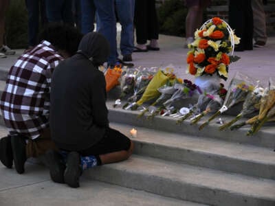 Students and residents commemorate those who lost their lives by laying flowers near the scene of a mass shooting at Apalachee High School in Winder, Georgia, on September 4, 2024.