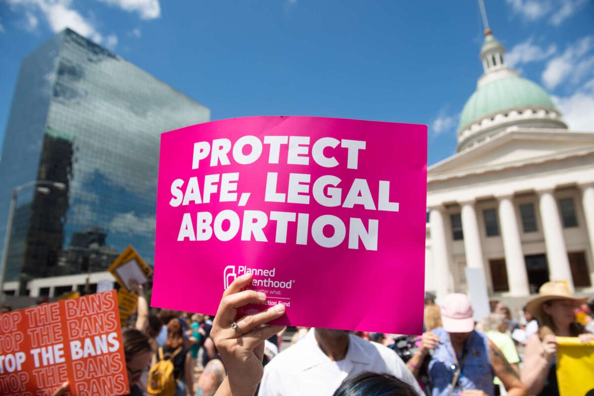 Protesters hold signs as they rally in support of Planned Parenthood and abortion rights, near the Old Courthouse in St. Louis, Missouri, on May 30, 2019.