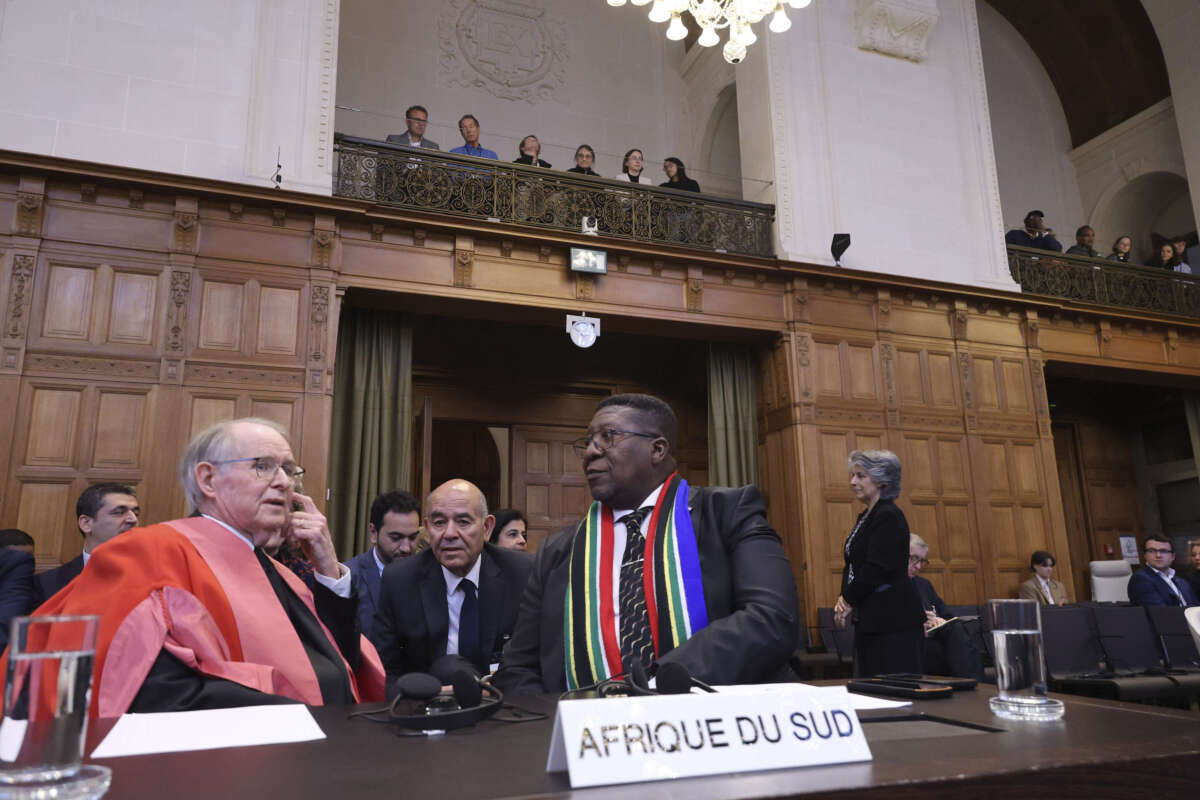 South African Ambassador to the Netherlands Vusimuzi Madonsela and members of the delegation sit in the courtroom of the International Court of Justice (ICJ) in The Hague, the Netherlands, on May 24, 2024.