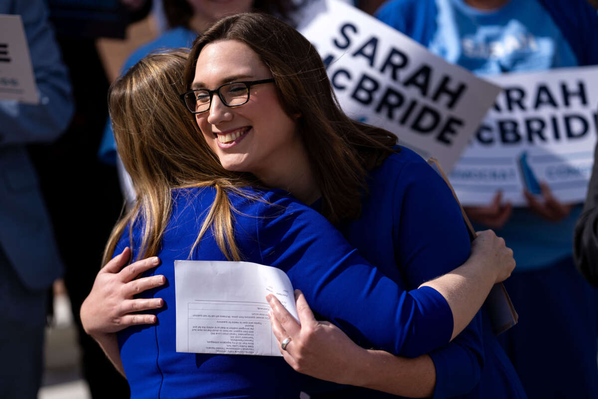 Democratic congressional candidate from Delaware Sarah McBride hugs Delaware State Treasurer Colleen Davis during a press conference on the steps of Delaware Legislative Hall on March, 4 2024, in Dover, Delaware.