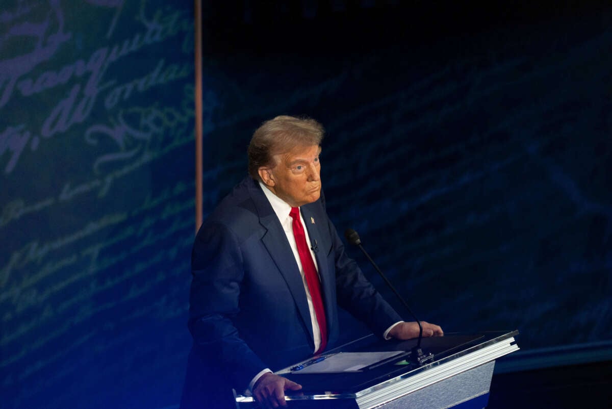 Former President Donald Trump reacts as Vice President Kamala Harris speaks during the first presidential debate at National Constitution Center in Philadelphia, Pennsylvania, on September 10, 2024.