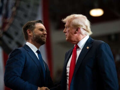 Republican vice presidential nominee Sen. J.D. Vance introduces former President Donald Trump during a rally at Herb Brooks National Hockey Center on July 27, 2024, in St Cloud, Minnesota.