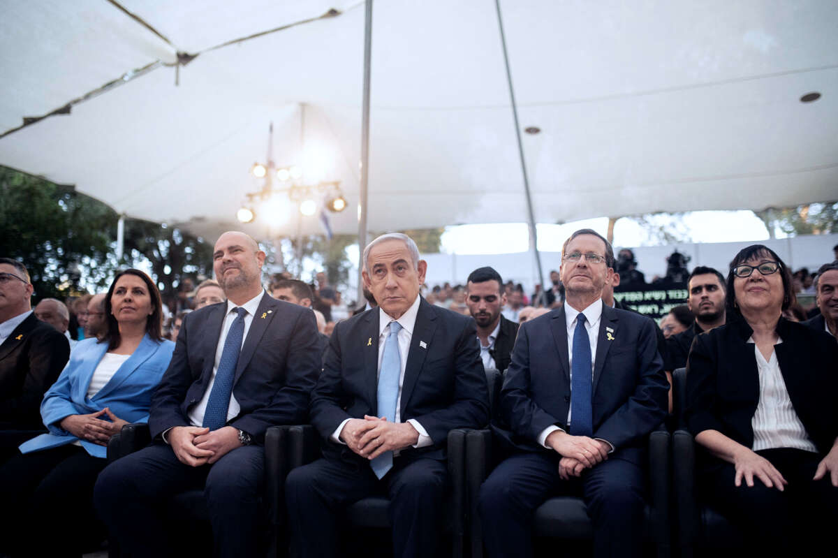 Benjamin Netanyahu and members of the Israeli Knesset sit at an event