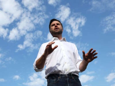 Republican vice presidential nominee Sen. J.D. Vance speaks to reporters in front of the border wall with Mexico on September 6, 2024, in San Diego, California.