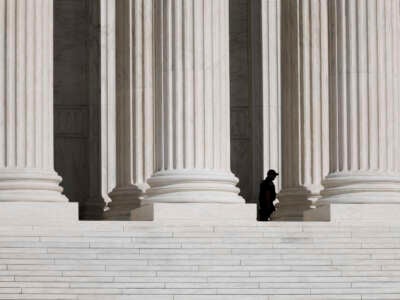 A Supreme Court police officer walks along the court steps on September 10, 2024, on Capitol Hill in Washington, D.C.