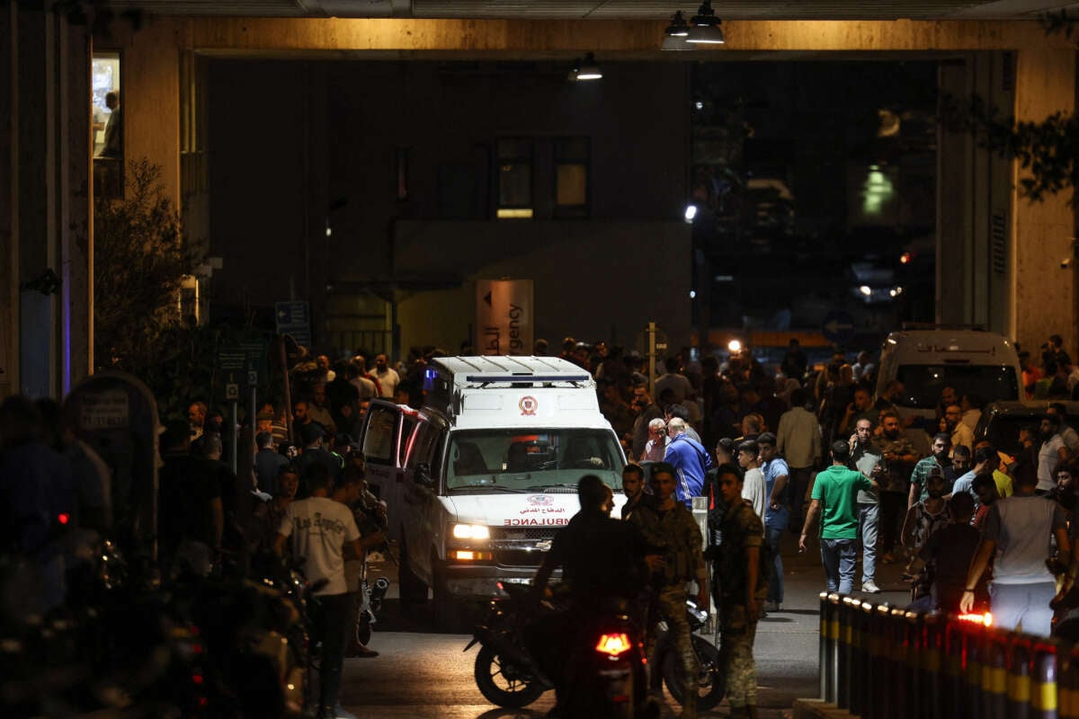 Ambulances are surrounded by people at the entrance of the American University of Beirut Medical Center, on September 17, 2024, after explosions hit locations in several Hezbollah strongholds around Lebanon amid ongoing cross-border tensions between Israel and Hezbollah fighters.