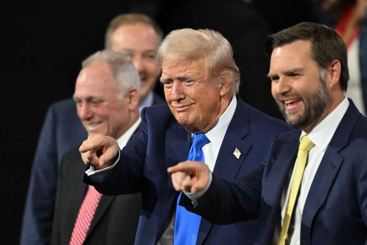 Former President Donald Trump stands next to Sen. J.D. Vance (right) during the second day of the 2024 Republican National Convention at the Fiserv Forum in Milwaukee, Wisconsin, on July 16, 2024.