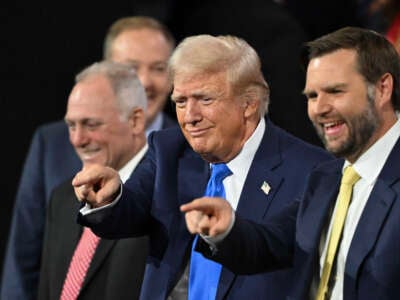 Former President Donald Trump stands next to Sen. J.D. Vance (right) during the second day of the 2024 Republican National Convention at the Fiserv Forum in Milwaukee, Wisconsin, on July 16, 2024.