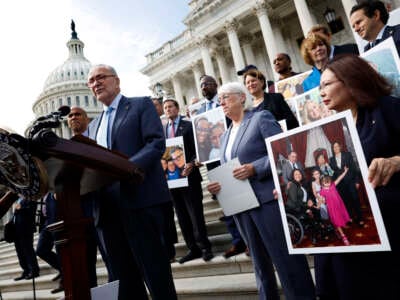 Senate Majority Leader Charles Schumer speaks alongside fellow Democrats holding photos of familles that have benefited from IVF treatment during a press conference on the Right to IVF Act, outside of the U.S. Capitol on September 17, 2024, in Washington, D.C.