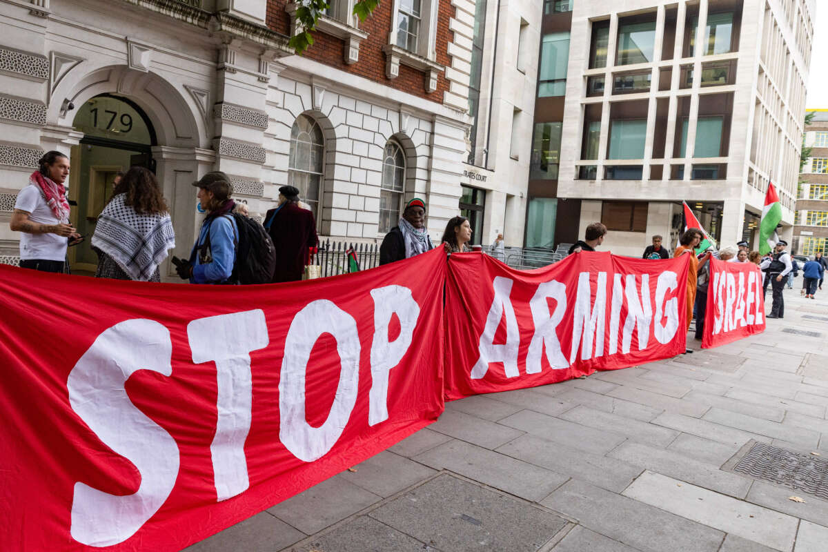 Supporters of Palestine Action, a pro-Palestinian protest group which uses direct action tactics to disrupt and to attempt to close down sites believed to be linked to weapons manufacturers supplying arms to Israel, gather outside Westminster Magistrates Court on the occasion of a plea hearing involving the group's co-founder Richard Barnard on September 18, 2024, in London, United Kingdom.