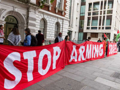 Supporters of Palestine Action, a pro-Palestinian protest group which uses direct action tactics to disrupt and to attempt to close down sites believed to be linked to weapons manufacturers supplying arms to Israel, gather outside Westminster Magistrates Court on the occasion of a plea hearing involving the group's co-founder Richard Barnard on September 18, 2024, in London, United Kingdom.