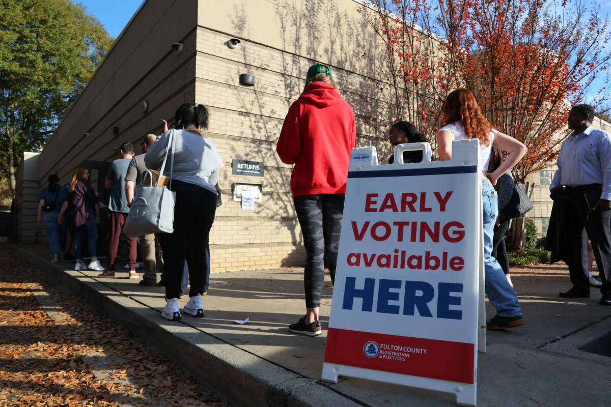 People wait in line for early voting for the midterm elections at Ponce De Leon Library on November 4, 2022, in Atlanta, Georgia.