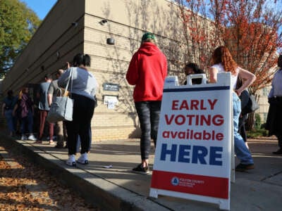 People wait in line for early voting for the midterm elections at Ponce De Leon Library on November 4, 2022, in Atlanta, Georgia.