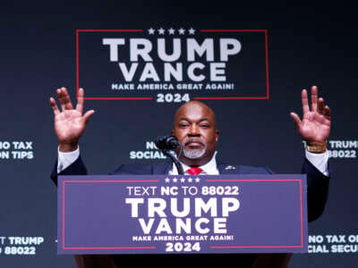 North Carolina Lt. Governor Mark Robinson walks on stage during a campaign event for Republican presidential nominee Donald Trump inside Harrah's Cherokee Center in Asheville, North Carolina, on August 14, 2024.