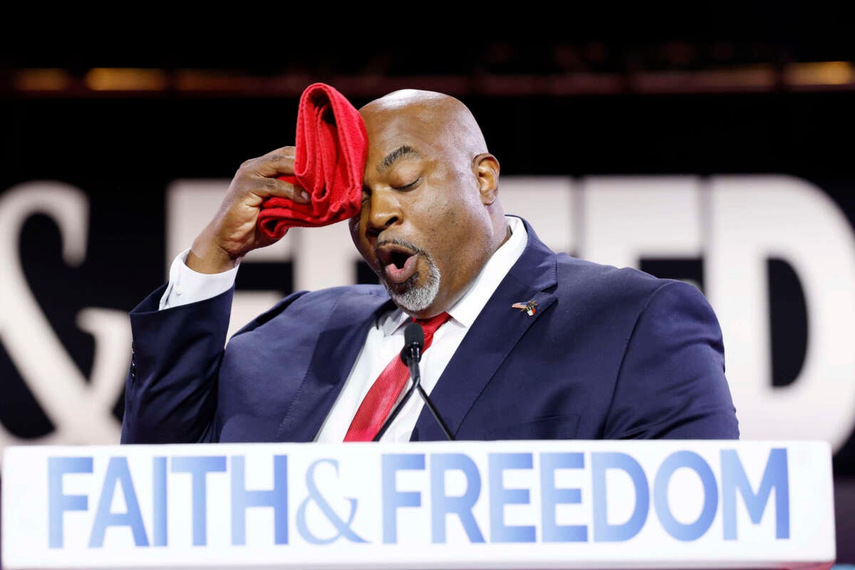 North Carolina Lieutenant Governor Mark Robinson wipes his brow as he speaks at the Faith and Freedom Road to Majority conference at the Washington Hilton on June 21, 2024, in Washington, D.C.