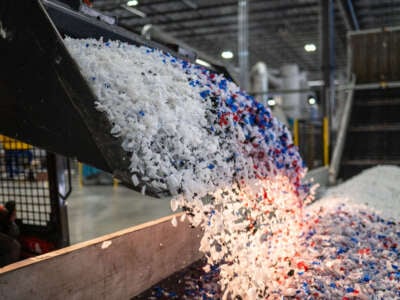 Plastic is loaded onto a conveyer belt at ExxonMobil's chemical recycling plant on October 11, 2023, in Baytown, Texas.