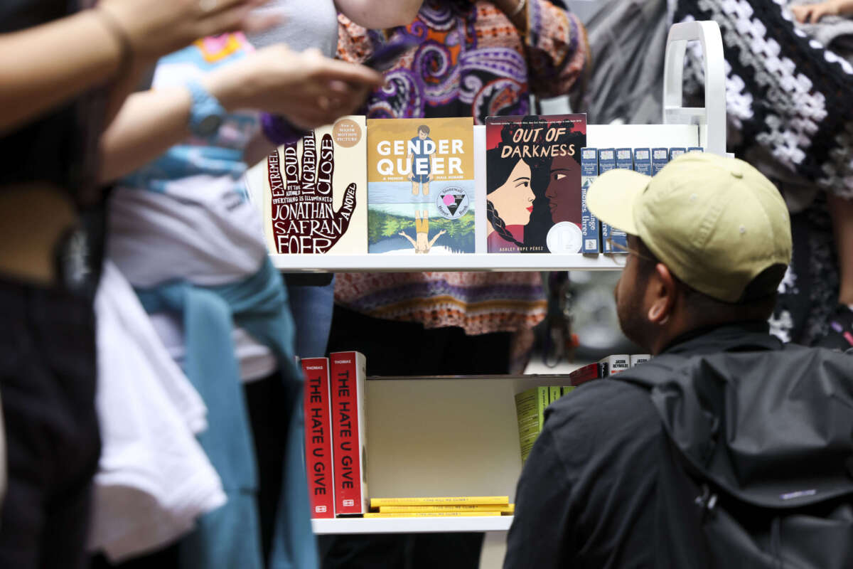 A person looks at the free banned books during the MoveOn Banned Bookmobile Tour stop outside of Sandmeyer's Bookstore in the South Loop on July 13, 2023, in Chicago, Illinois.