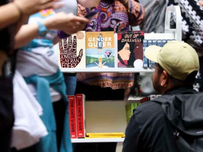 A person looks at the free banned books during the MoveOn Banned Bookmobile Tour stop outside of Sandmeyer's Bookstore in the South Loop on July 13, 2023, in Chicago, Illinois.