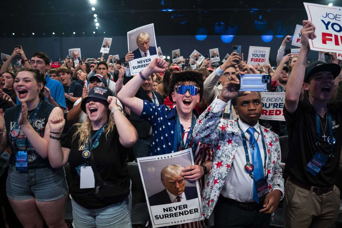 Supporters cheer as Republican presidential candidate and former President Donald Trump speaks at Turning Point USA Action's The People's Convention in Detroit, Michigan, on June 14, 2024.