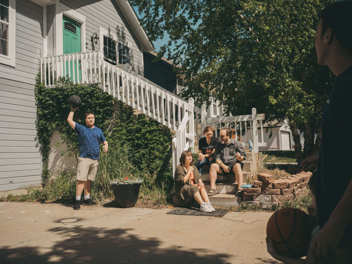 Jessica Patterson at home with her husband and four kids in Olathe, Kansas.