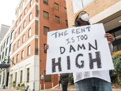 A member of the Tenant Unions Federation, a national "union of unions," gathers in Washington D.C. in May to demand better protections from abusive corporate landlords that benefit from federally backed financing.