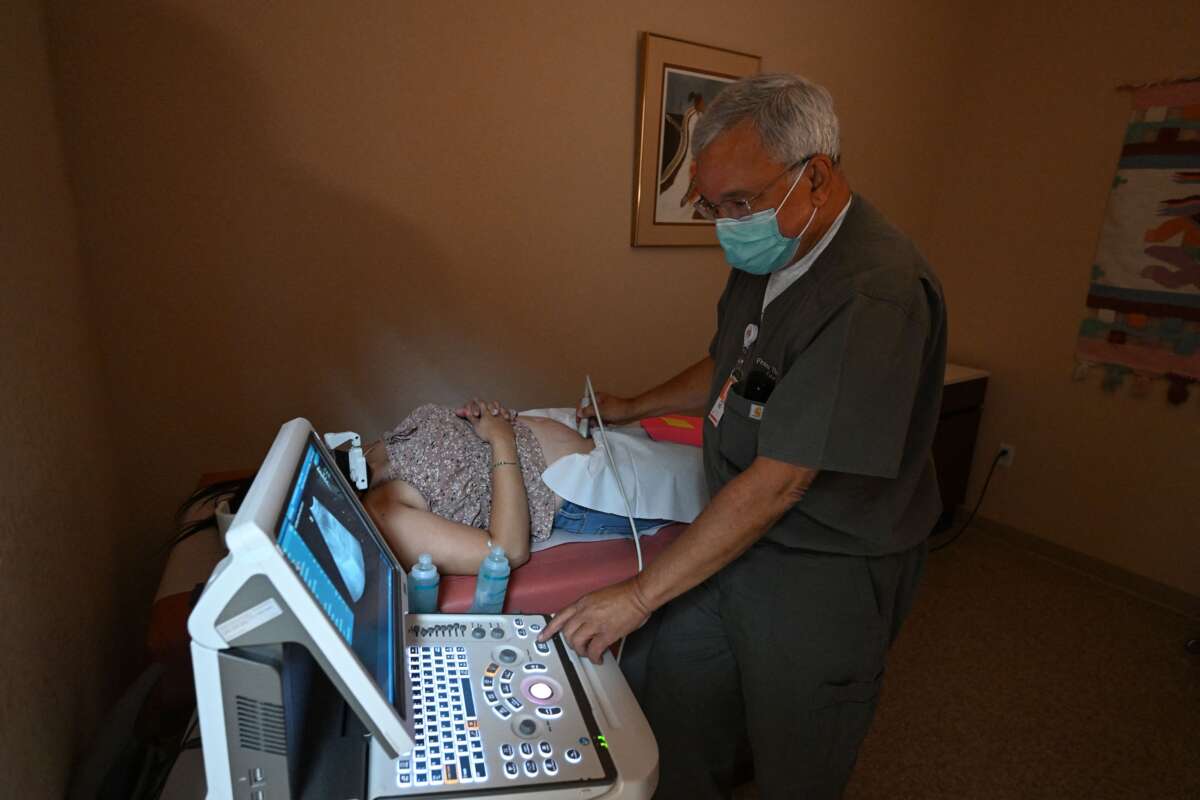 Dr. Franz Theard performs a sonogram to confirm pregnancy on a patient seeking abortion services at the Women's Reproductive Clinic, in Santa Teresa, New Mexico, on June 15, 2022.