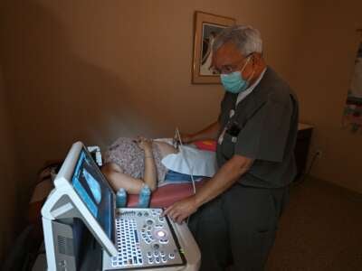 Dr. Franz Theard performs a sonogram to confirm pregnancy on a patient seeking abortion services at the Women's Reproductive Clinic, in Santa Teresa, New Mexico, on June 15, 2022.