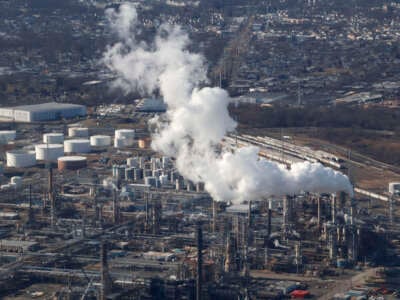 An emission comes out of a smoke stack at the Phillips 66 Refinery in Linden, New Jersey, on February 6, 2024.