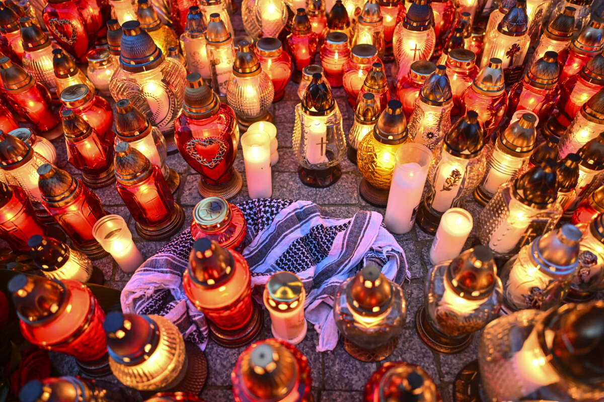 People place candles and flowers for Damian Sobol, an aid worker for World Central Kitchen who was killed by an Israeli airstrike, in front of the train station in Przemysl, Poland, on April 4, 2024.